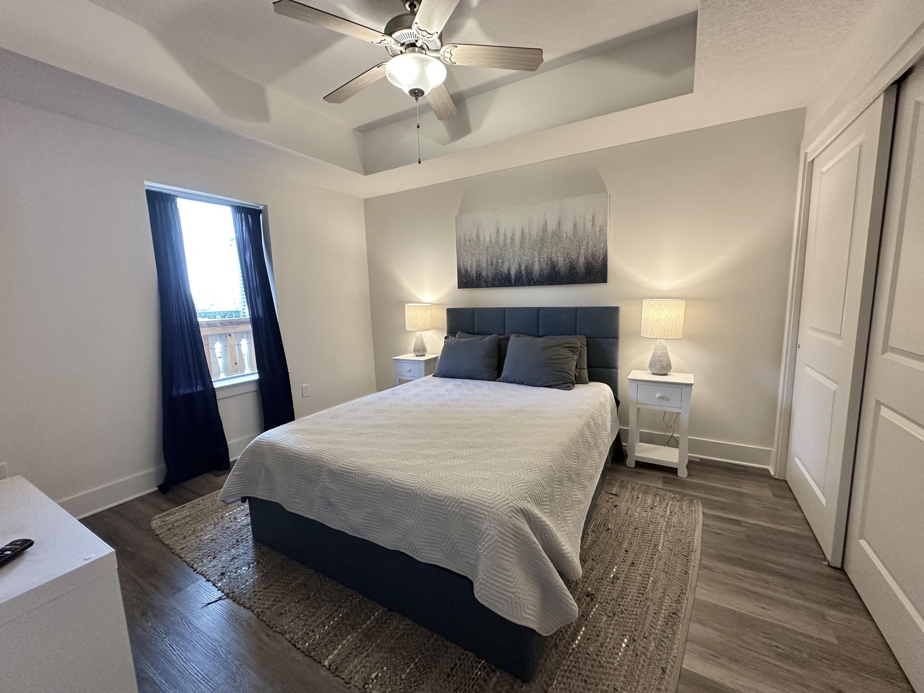 15928 Front Beach Road, Unit 3702 Panama City Beach, FL 32413 - Photo 35 of 85 a bedroom with a bed and a window