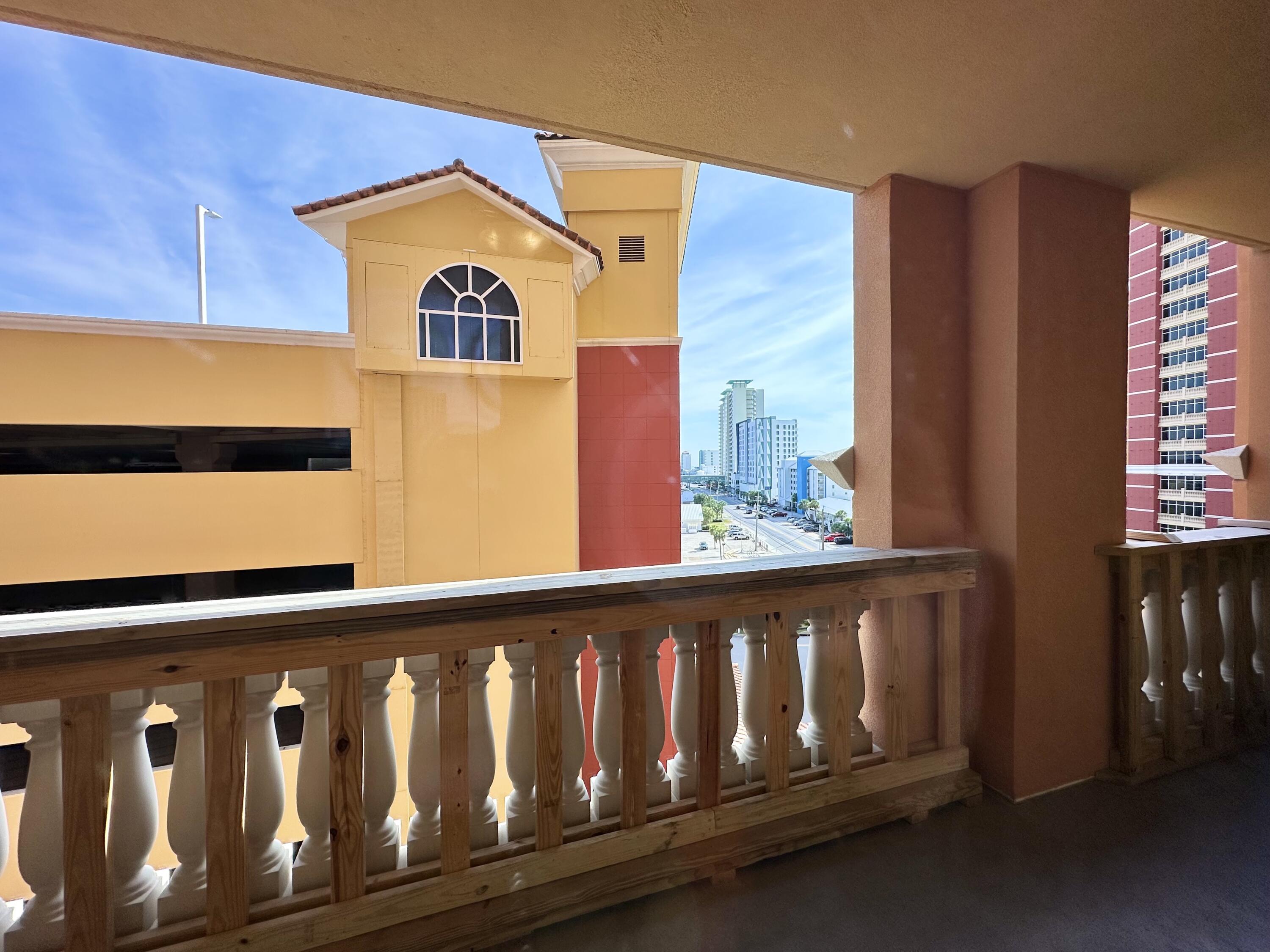 15928 Front Beach Road, Unit 3702 Panama City Beach, FL 32413 - Photo 36 of 85 a front view of a house with entryway and wooden floor