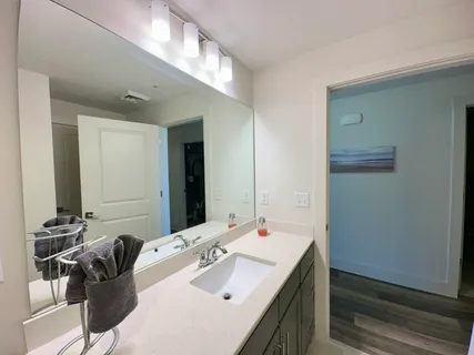 a living room with a couch and a stove