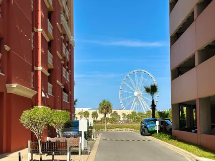a front view of a house with garden and outdoor seating