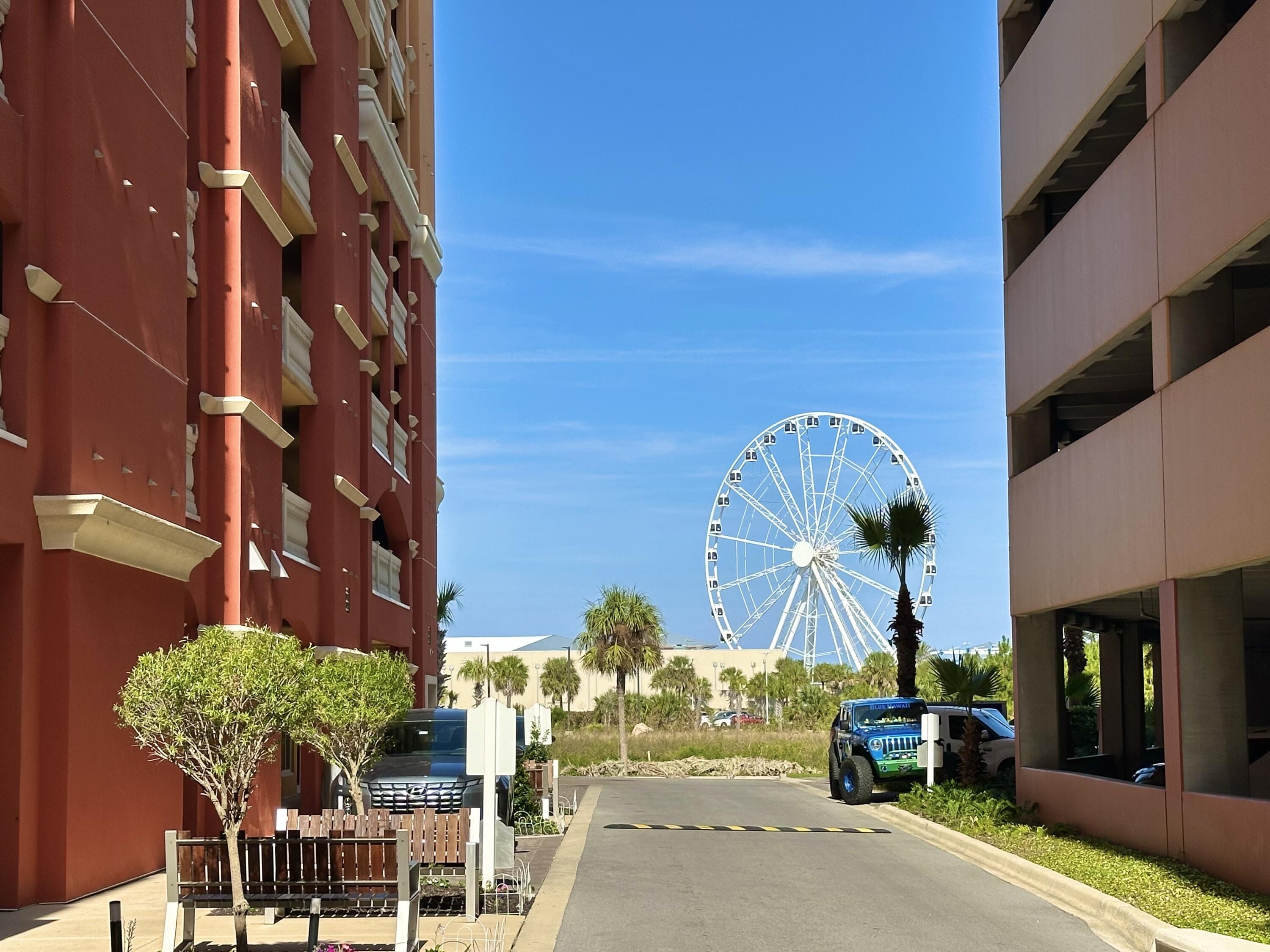 15928 Front Beach Road, Unit 3702 Panama City Beach, FL 32413 - Photo 50 of 85 a view of a building with a tree in front