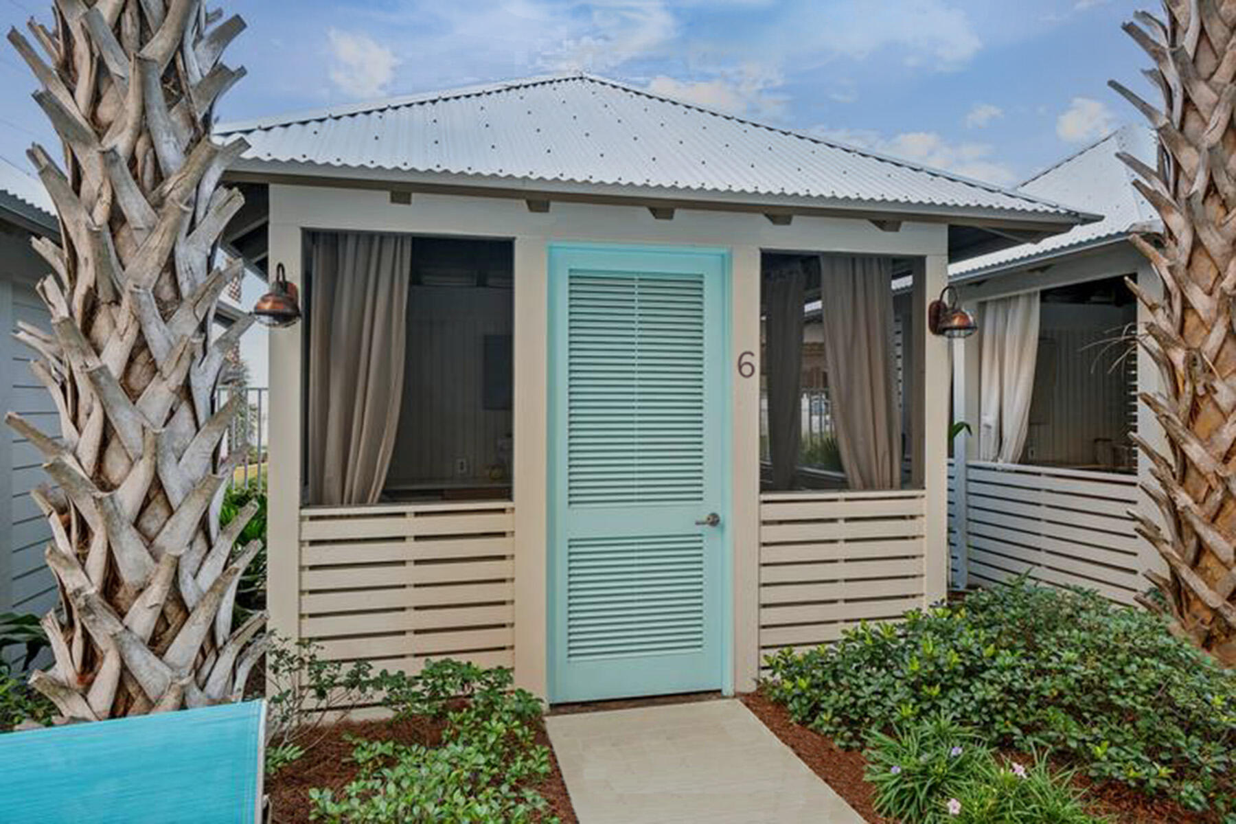 15928 Front Beach Road, Unit 3702 Panama City Beach, FL 32413 - Photo 61 of 85 a front view of a house with a garden