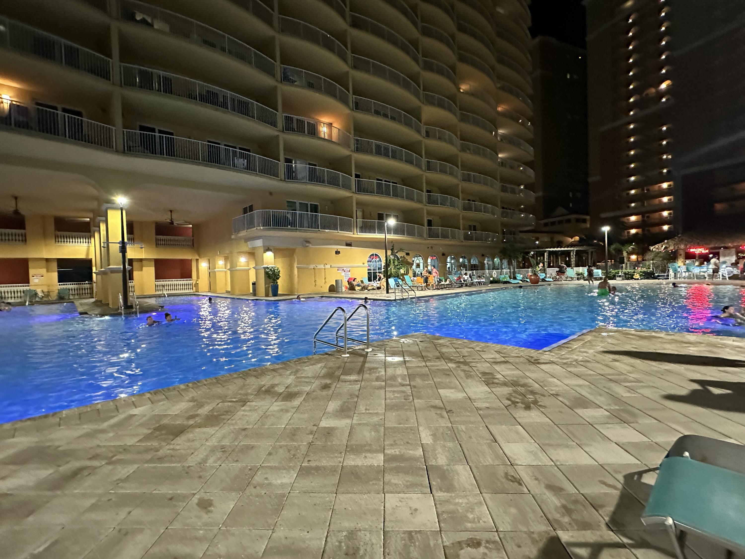 15928 Front Beach Road, Unit 3702 Panama City Beach, FL 32413 - Photo 77 of 85 a view of a swimming pool with an outdoor space