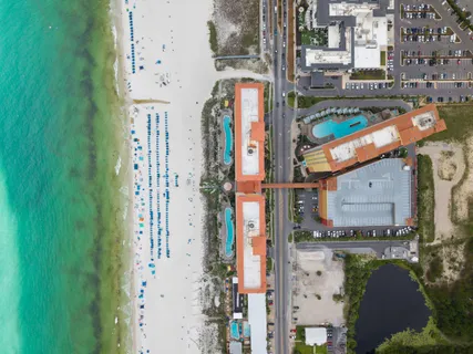 a kitchen with stainless steel appliances a refrigerator a sink a stove top oven a counter space and cabinets