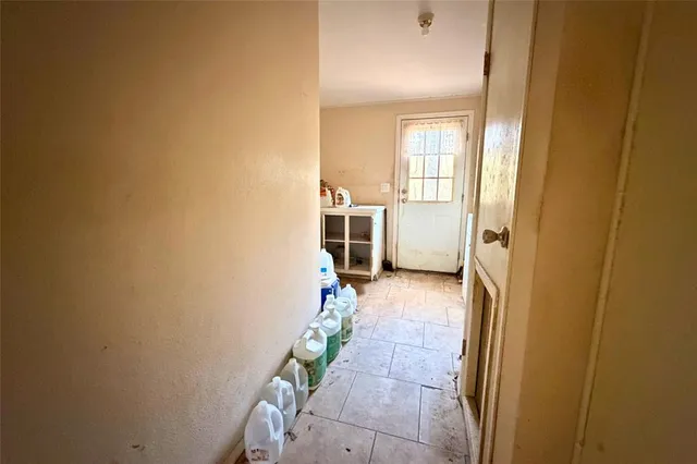 a view of a livingroom with furniture and a window