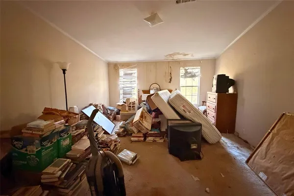 a bedroom with two beds and a mirror