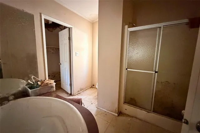a bathroom with a sink and mirror with tub