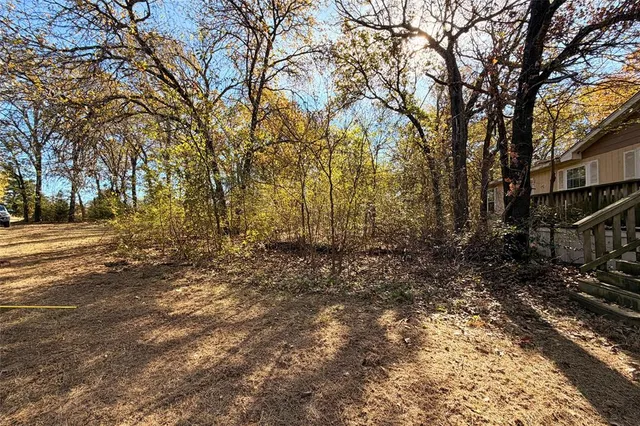 a view of balcony with wooden floor and fence