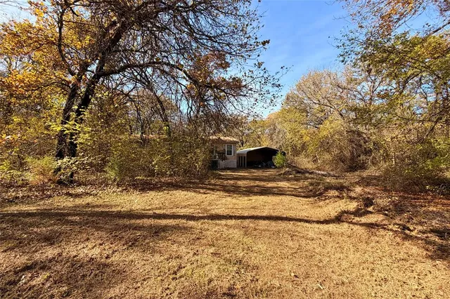 a view of a backyard of a house