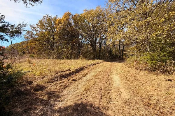 a view of yard covered with snow in front of house