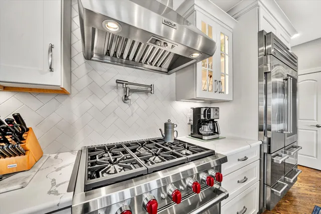 a utility room with sink dryer and washer