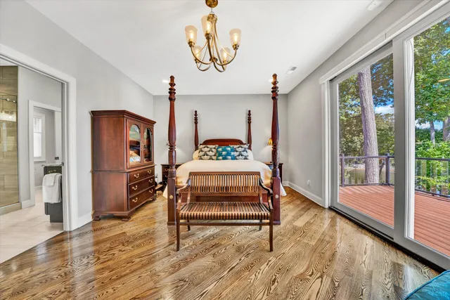 a bathroom with a granite countertop toilet sink and mirror