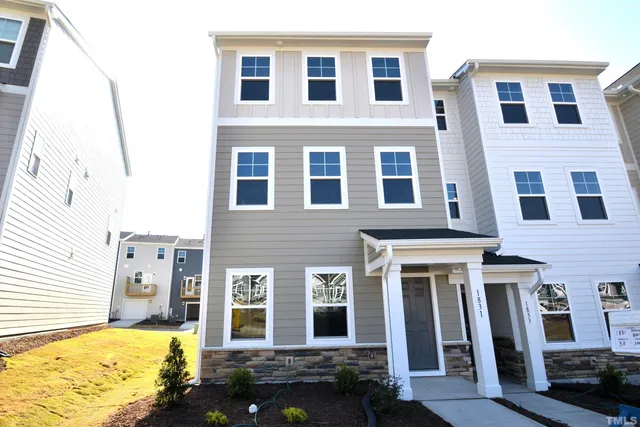 a front view of a building with many windows