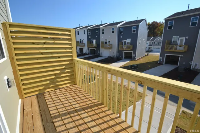 a view of balcony with wooden floor