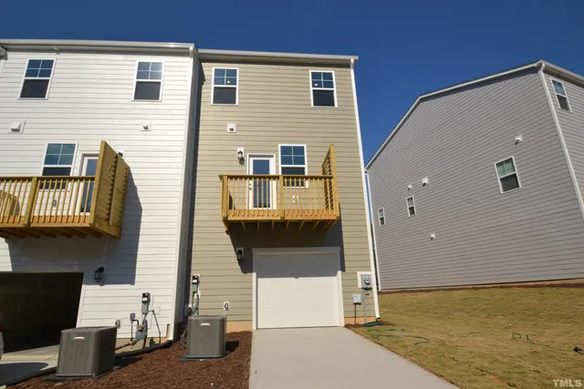 a front view of a house with large windows