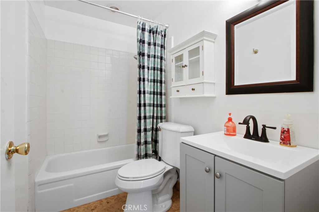 4 Brisa Irvine, CA 92620 - Photo 16 of 17 a bathroom with a sink toilet vanity and tub