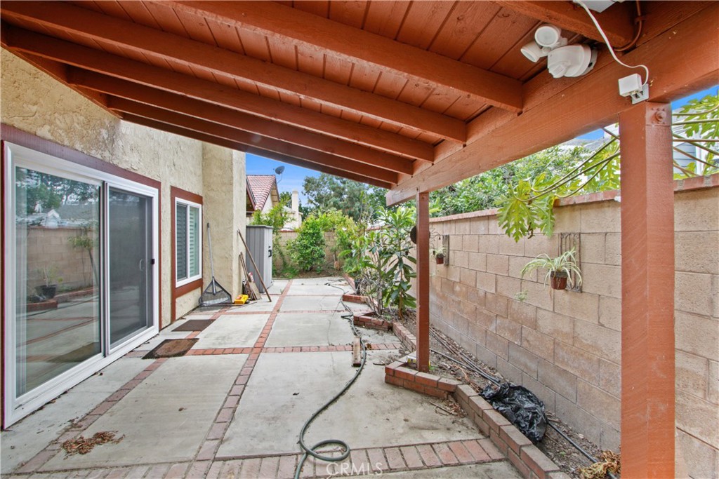4 Brisa Irvine, CA 92620 - Photo 6 of 17 a backyard of a house with a fountain table and chairs