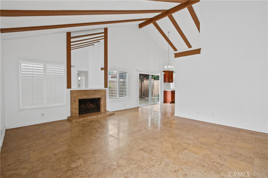 4 Brisa Irvine, CA 92620 - Photo 7 of 17 a view of empty room with fireplace and windows