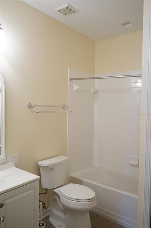 201 Sunset Crest Court Apollo Beach, FL 33572 - Photo 46 of 81 a white toilet sitting next to a bathroom sink