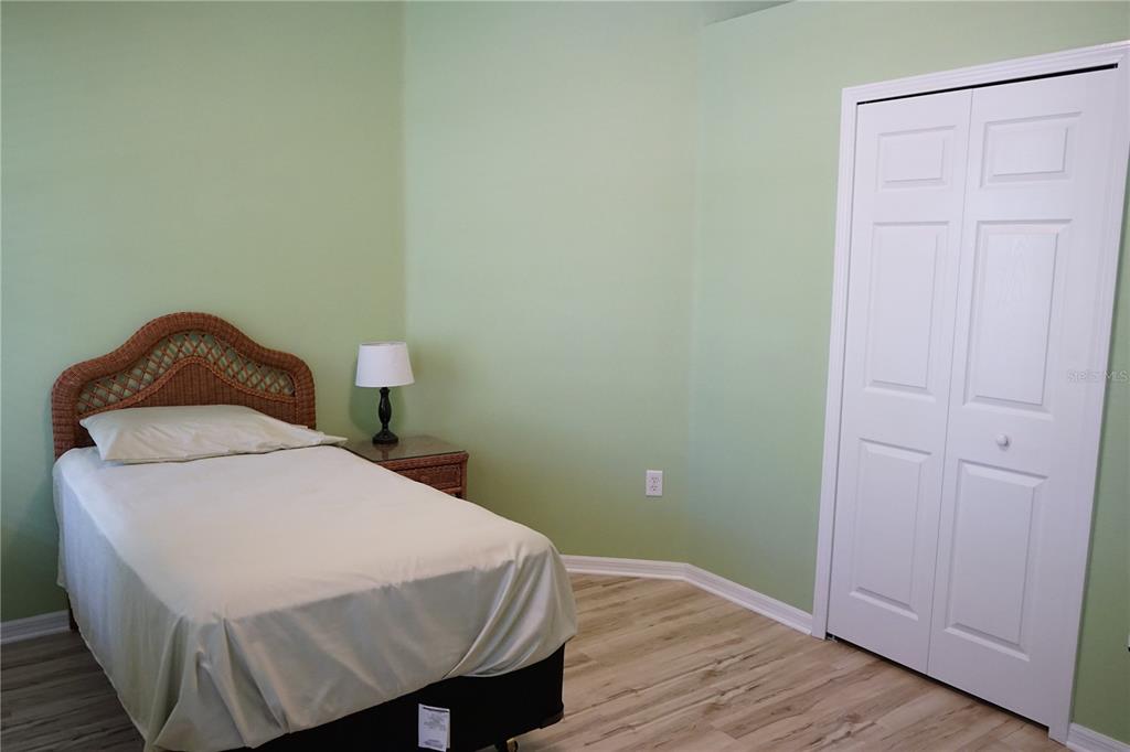 201 Sunset Crest Court Apollo Beach, FL 33572 - Photo 51 of 81 a bedroom with a bed and wooden floor