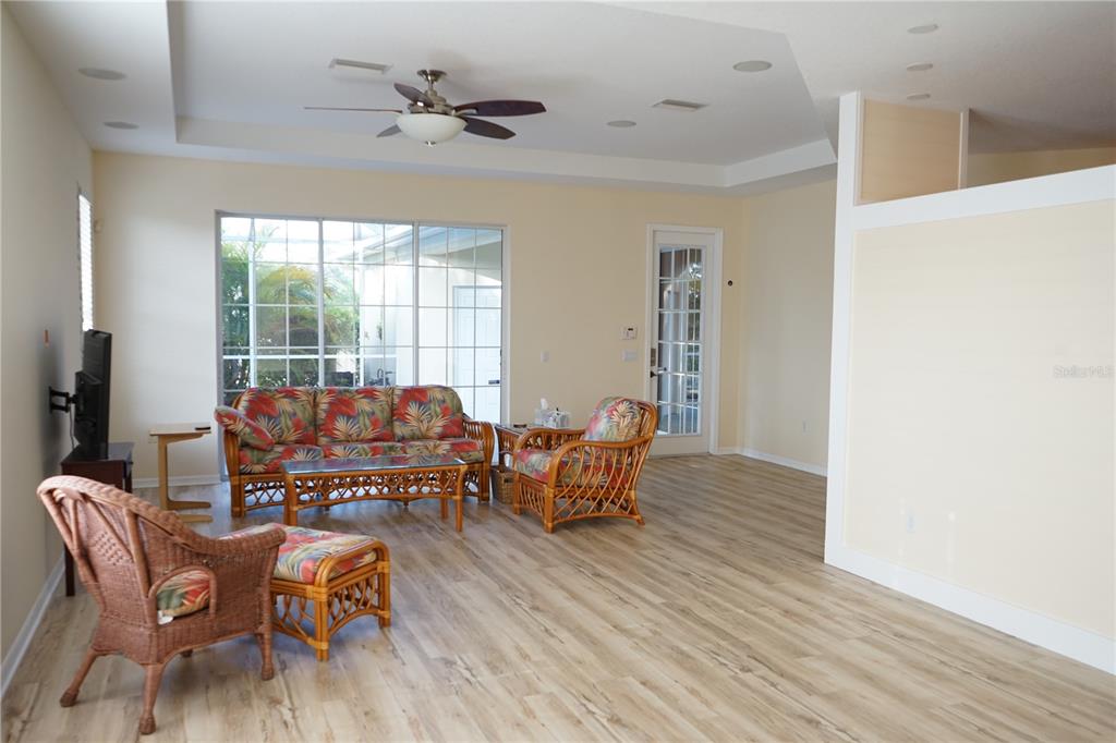 201 Sunset Crest Court Apollo Beach, FL 33572 - Photo 8 of 81 a living room with furniture and wooden floor