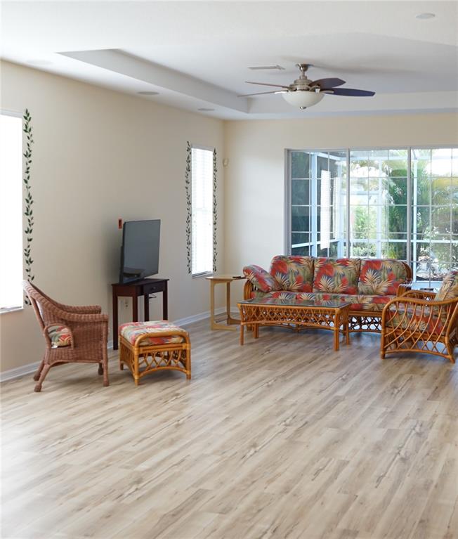 201 Sunset Crest Court Apollo Beach, FL 33572 - Photo 9 of 81 a living room with furniture and wooden floor