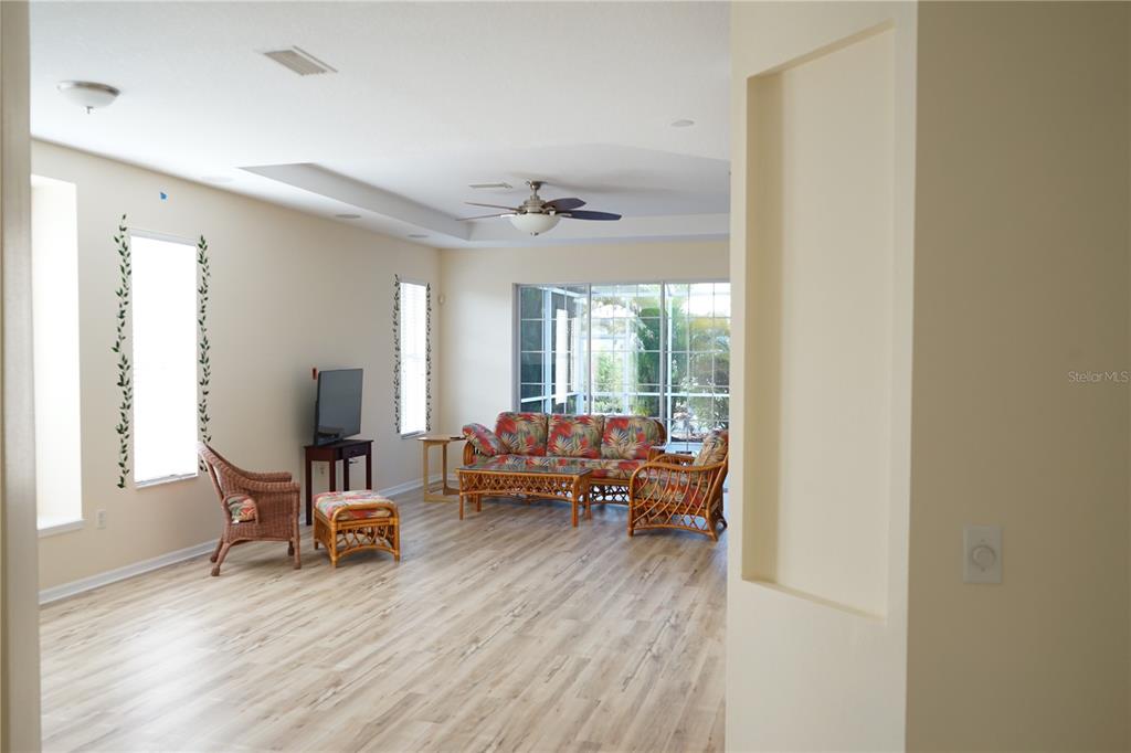 201 Sunset Crest Court Apollo Beach, FL 33572 - Photo 10 of 81 a living room with furniture and wooden floor