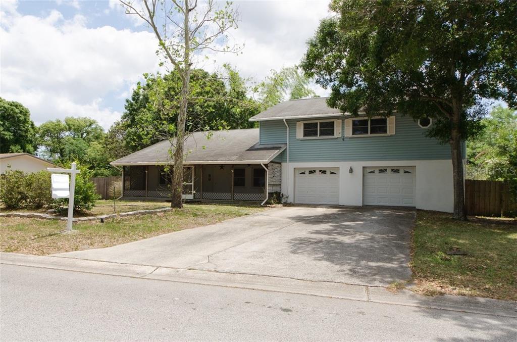 829 15th Avenue Southwest Largo, FL 33770 - Photo 1 of 1 a view of a house with backyard and trees
