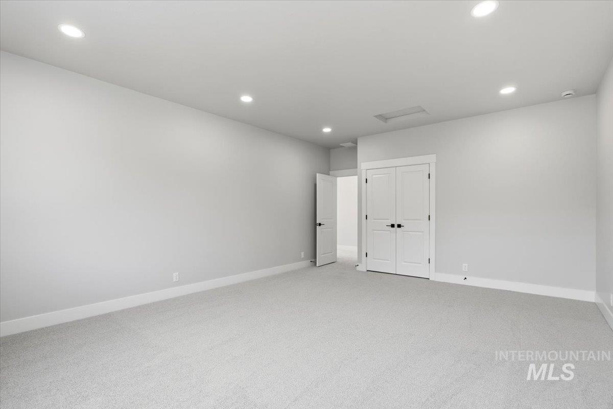 4317 Tropic Way Caldwell, ID 83607 - Photo 32 of 47 Spacious room featuring neutral walls, recessed ceiling lighting, and carpeting throughout