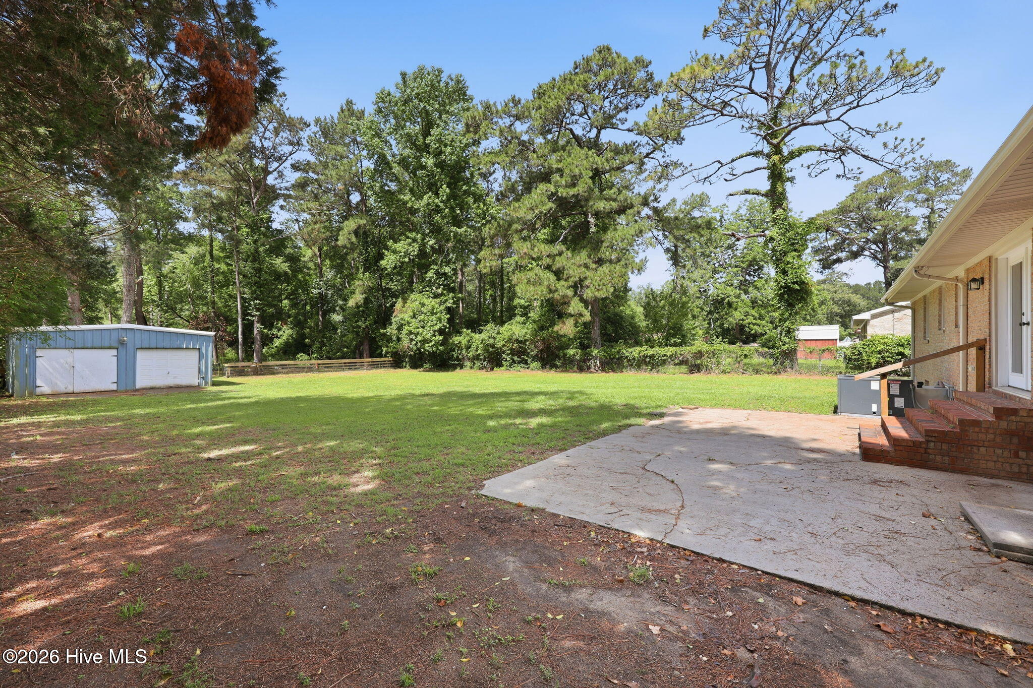 1040 Broad Creek Road New Bern, NC 28560 - Photo 24 of 47 Backayard view w/ large patio + 2 car detached garage