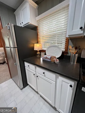 a stove top oven sitting inside of a kitchen
