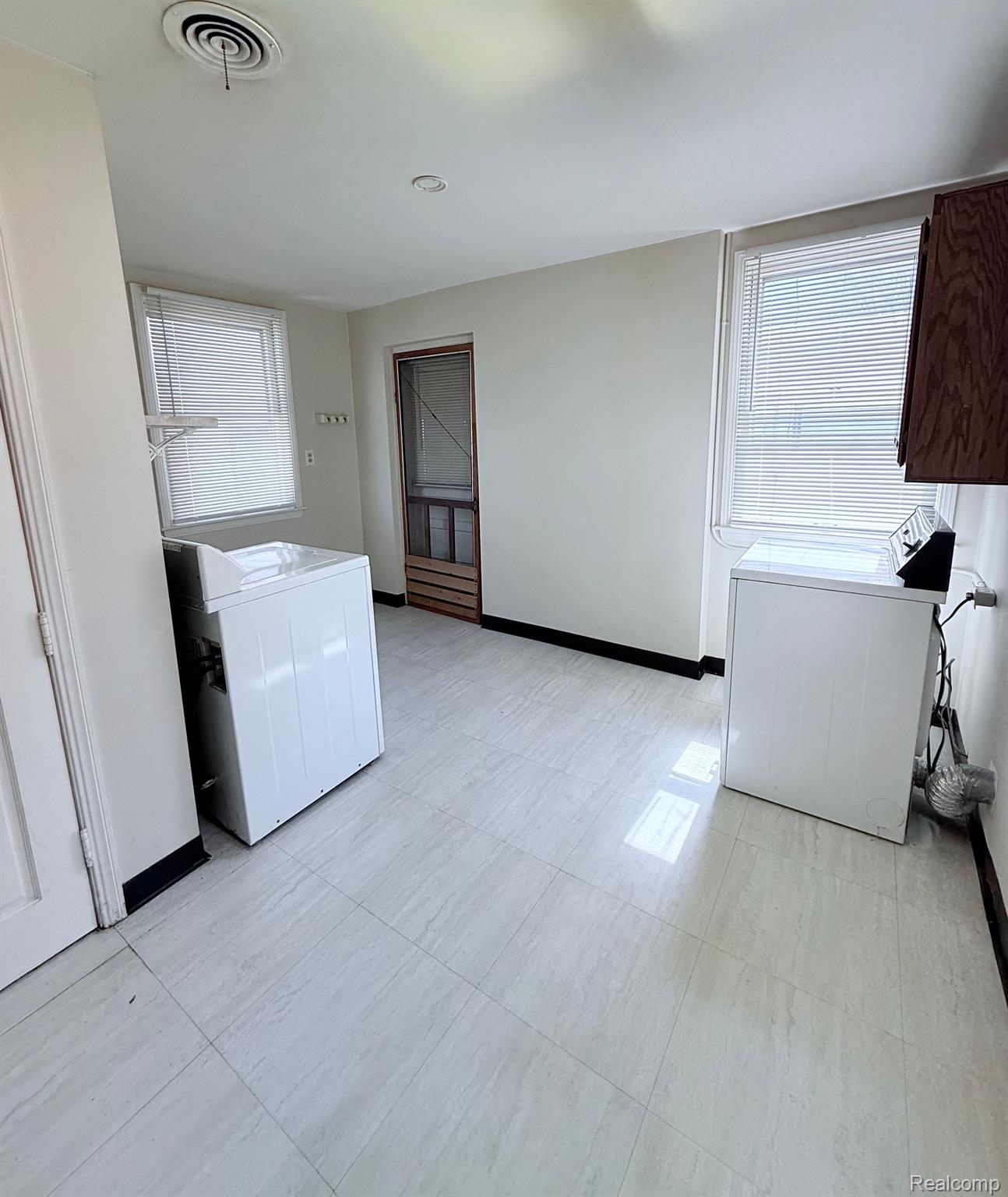 17836 12 Mile Road Roseville, MI 48066 - Photo 12 of 22 Laundry room and entrance to the garage