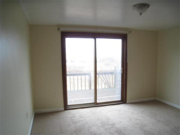 95 Bay Road, Unit A Revere, MA 02151 - Photo 11 of 12 an empty room with windows