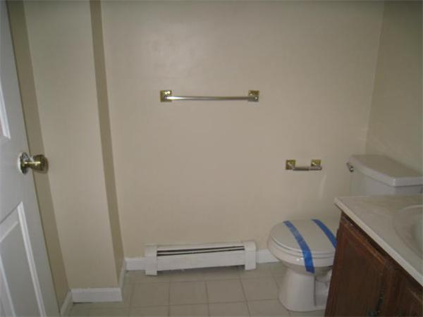95 Bay Road, Unit A Revere, MA 02151 - Photo 12 of 12 a bathroom with a sink and toilet