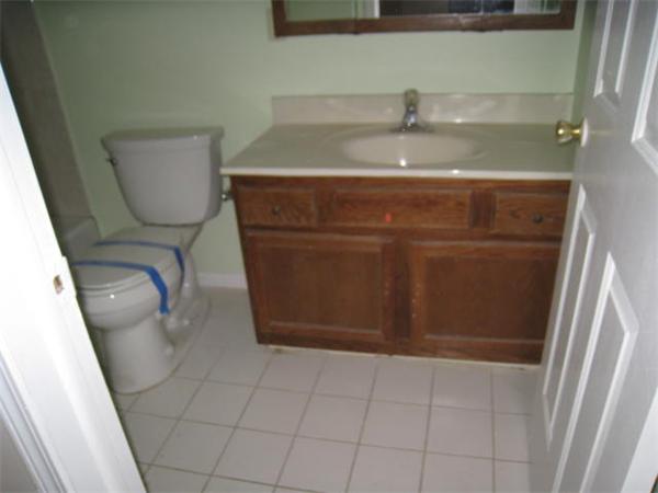95 Bay Road, Unit A Revere, MA 02151 - Photo 6 of 12 a bathroom with a sink and a mirror