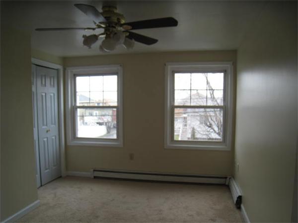 95 Bay Road, Unit A Revere, MA 02151 - Photo 7 of 12 an empty room with a window