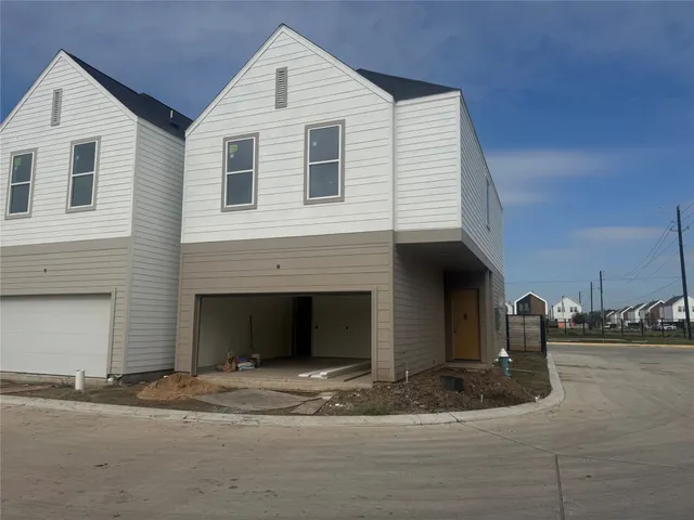 a front view of a house with parking