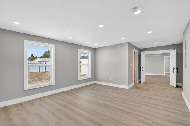 a spacious bedroom with a large bed and a couch