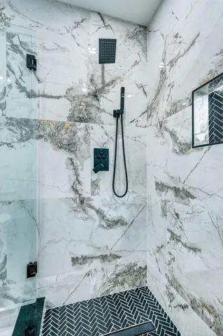 an empty room with wooden floor and window