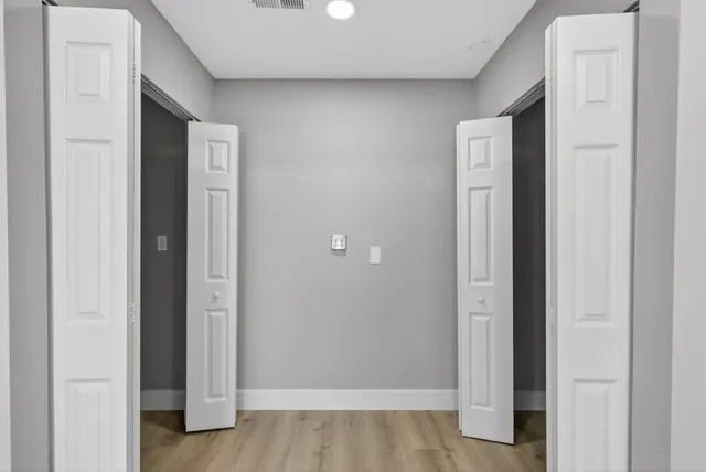 a view of a kitchen with stainless steel appliances granite countertop a refrigerator and a sink