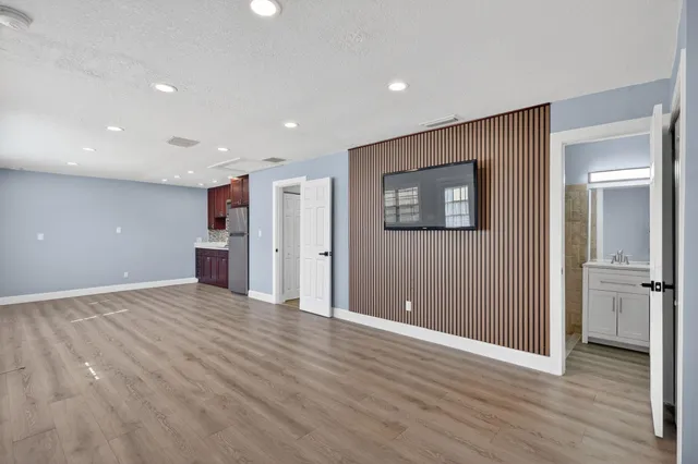 a bathroom with a toilet a sink and a mirror