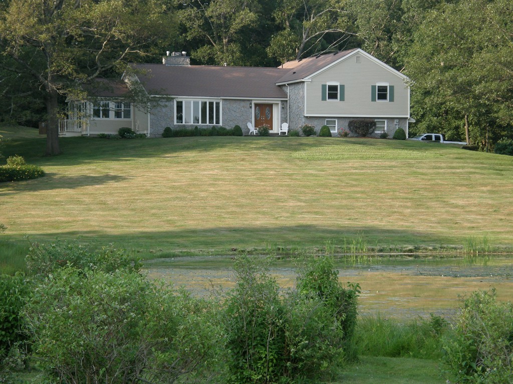 5 Corbin Road Dudley, MA 01571 - Photo 1 of 30 a front view of a house with a yard