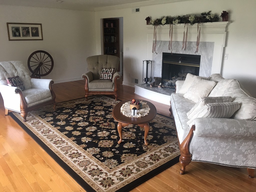 5 Corbin Road Dudley, MA 01571 - Photo 11 of 30 a living room with furniture and a table