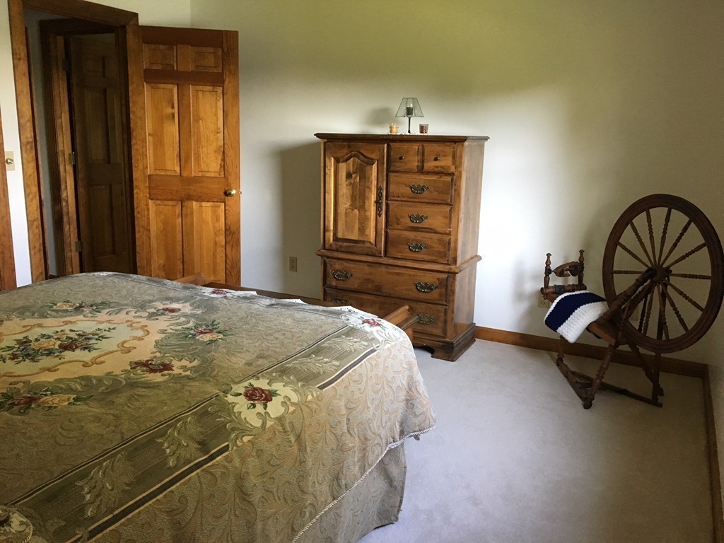 5 Corbin Road Dudley, MA 01571 - Photo 12 of 30 a bedroom with a bed dresser and a window