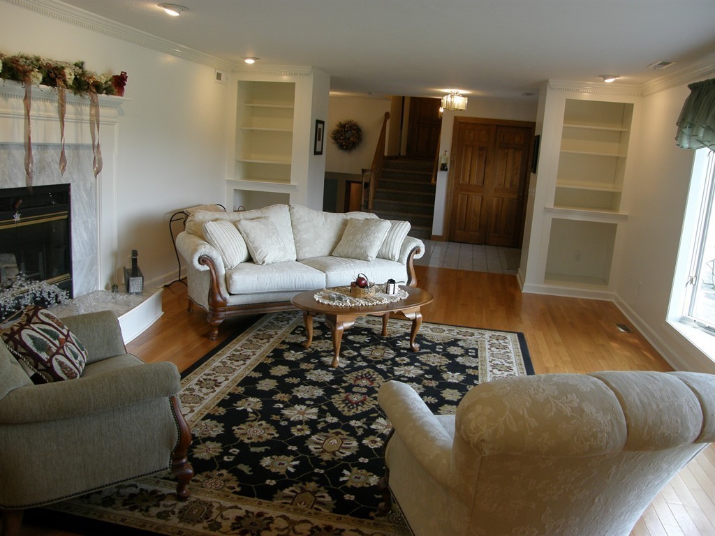 5 Corbin Road Dudley, MA 01571 - Photo 10 of 30 a living room with furniture rug and wooden floor