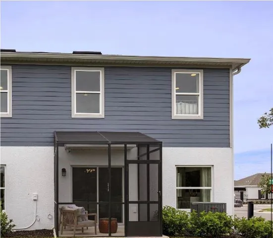 a front view of a house with glass windows