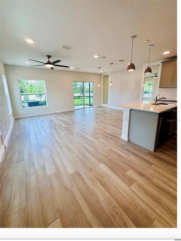 2895 Narcoossee Cmns Way St. Cloud, FL 34771 - Photo 5 of 10 a view of kitchen and windows