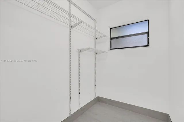 a view of a room with racks on the wall
