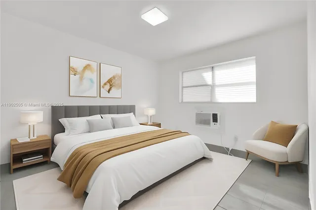 a bedroom with a bed and a couch