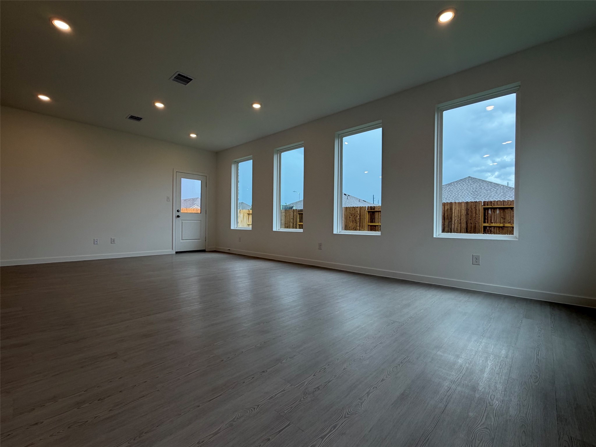2514 Rose Gold Drive Rosharon, TX 77583 - Photo 10 of 27 an empty room with wooden floor and windows